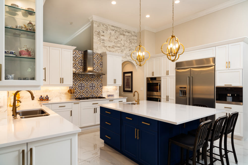 kitchen with white cabinets and blue island